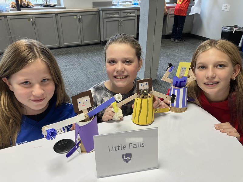 Students posing with engineering projects