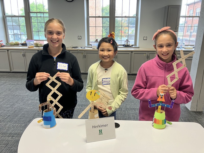Students posing with engineering projects
