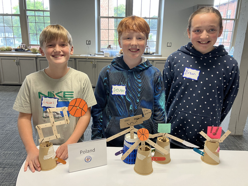 Students posing with engineering projects