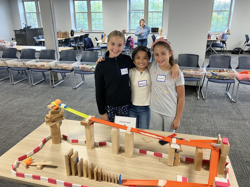 Students posing with engineering projects
