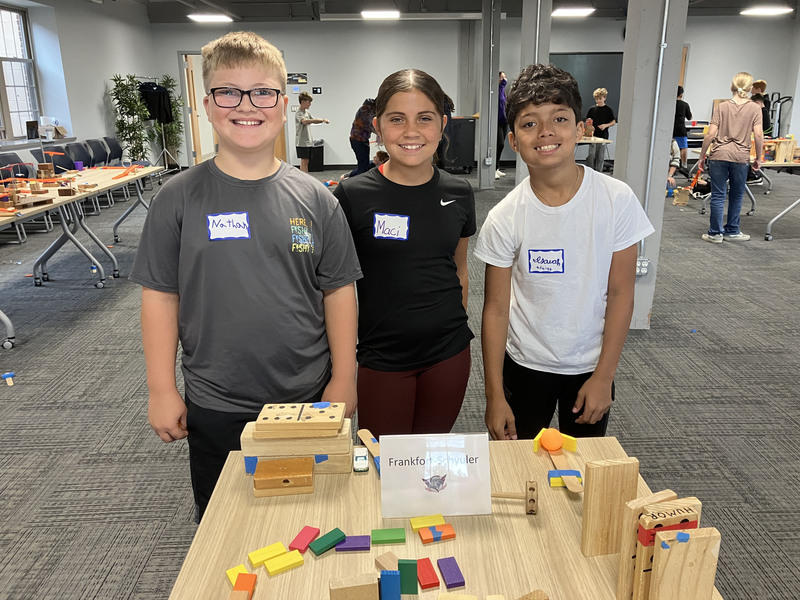 Students posing with engineering projects