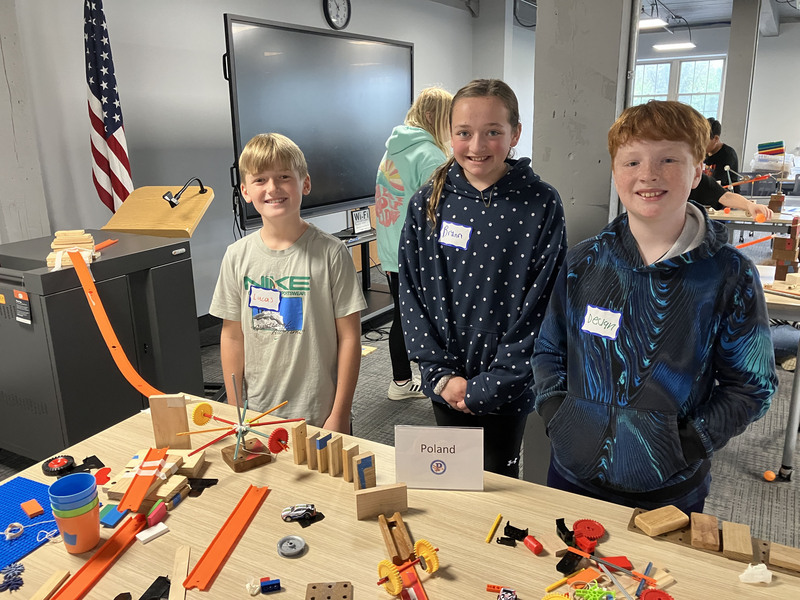Students posing with engineering projects