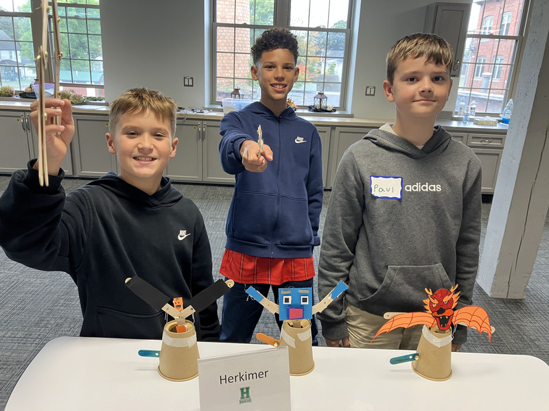 Students posing with engineering projects