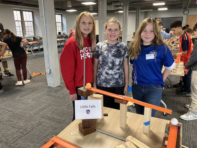 Students posing with engineering projects