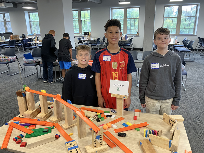 Students posing with engineering projects