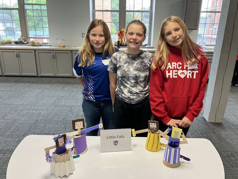 Students posing with engineering projects
