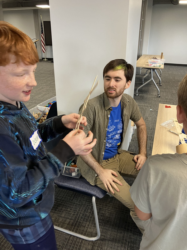 Student and presenter working on engineering project