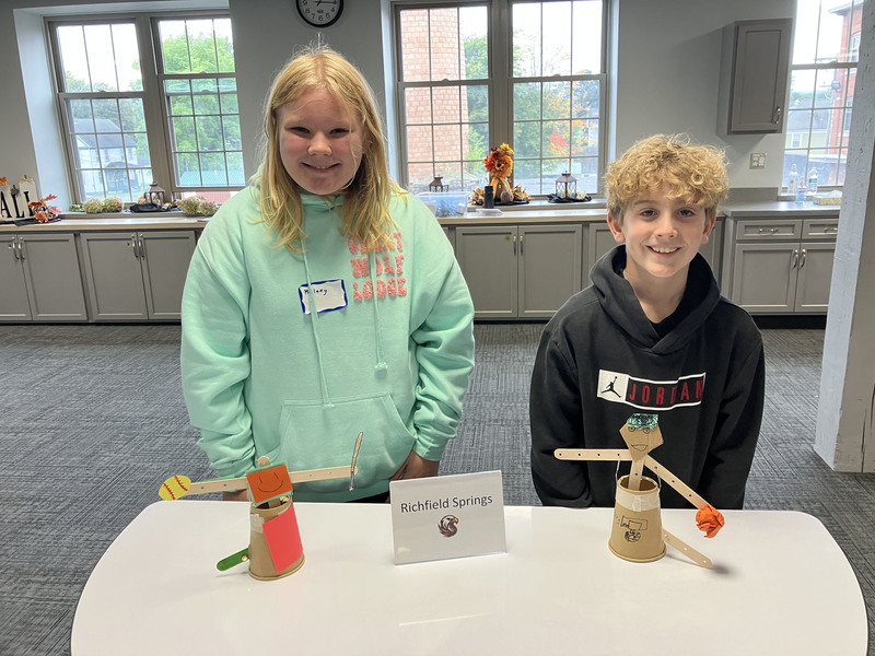 Students posing with engineering projects