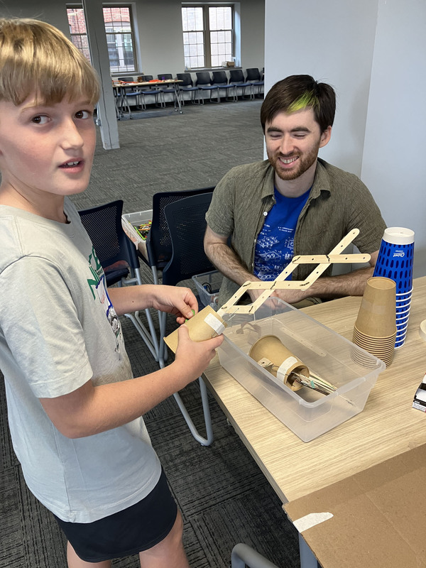 Student and presenter working on engineering project