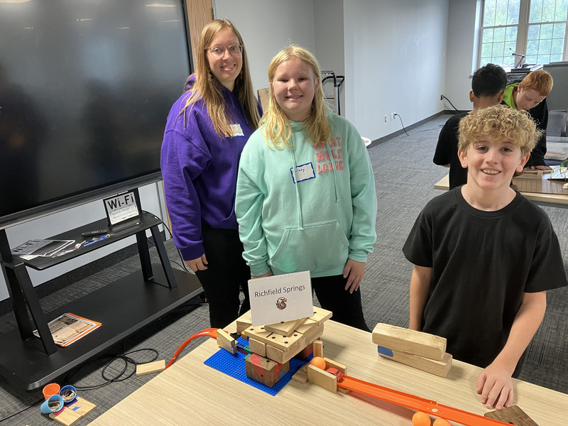 Students posing with engineering projects