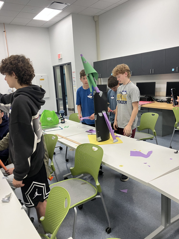 Students at tables in a classroom during SUNY Poly Tour