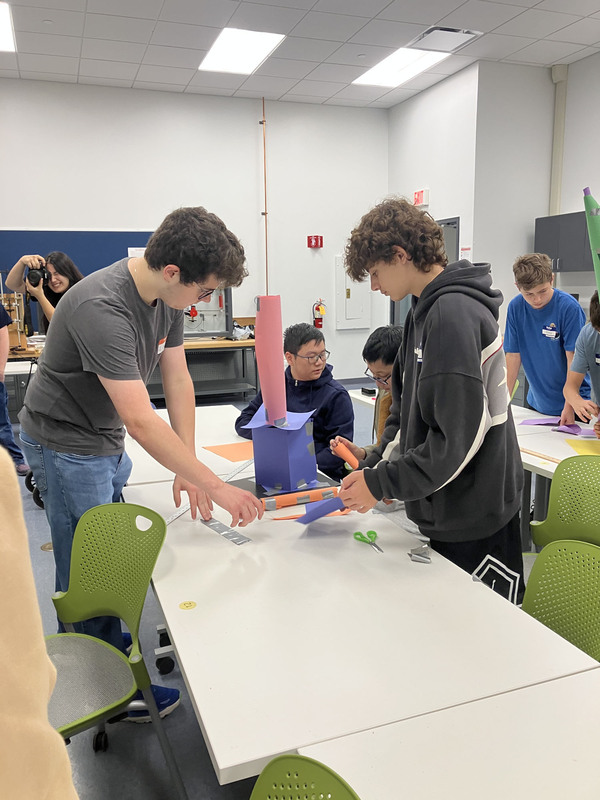 Students at tables in a classroom during SUNY Poly Tour