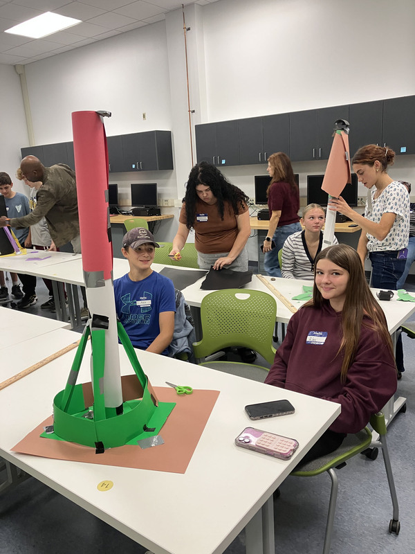 Students at tables in a classroom during SUNY Poly Tour
