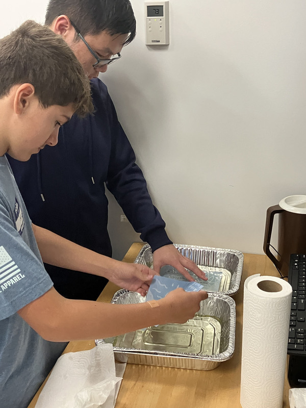 Two students working together on project