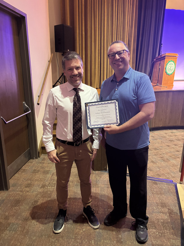 James Picolla and Adam Hutchinson holding a certificate