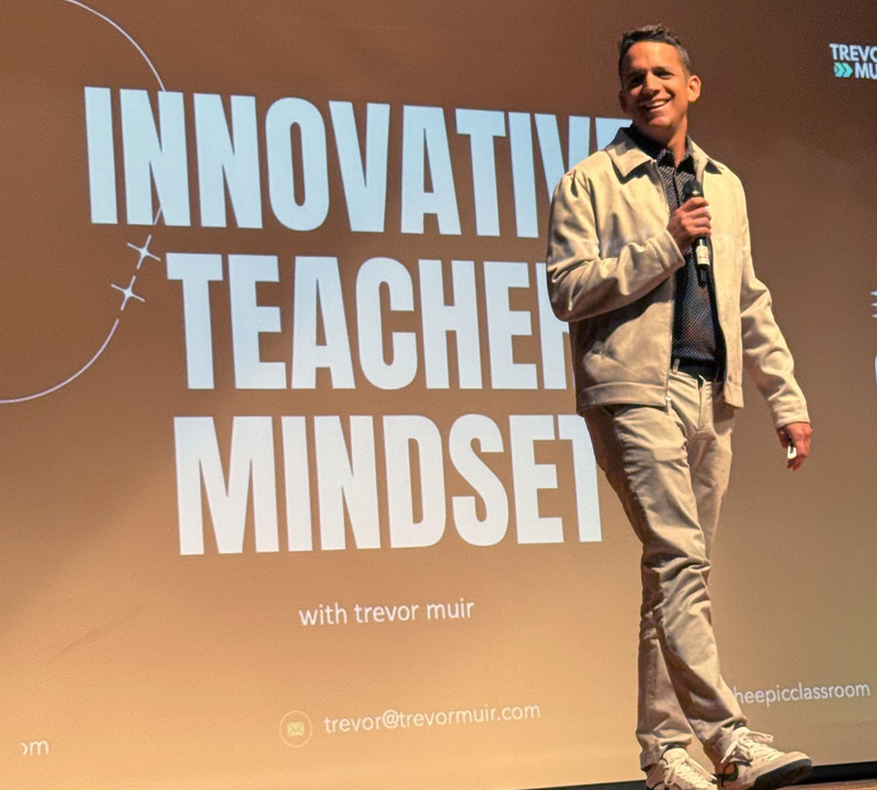 Trevor Muir speaking on stage