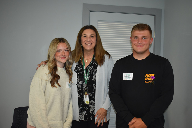 Two student board members and Kathleen Carney