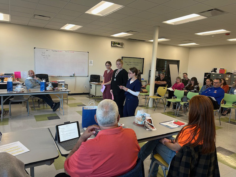 Three Health Science Careers students presenting at Herkimer BOCES Board of Education meeting
