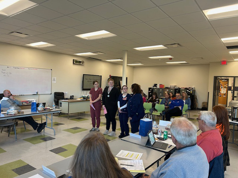 Three Health Science Careers students presenting at Herkimer BOCES Board of Education meeting