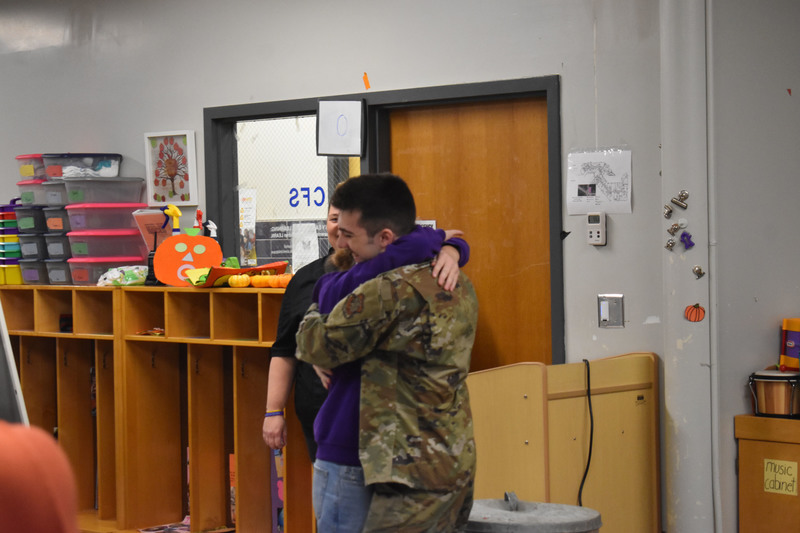 Brother and sister hugging
