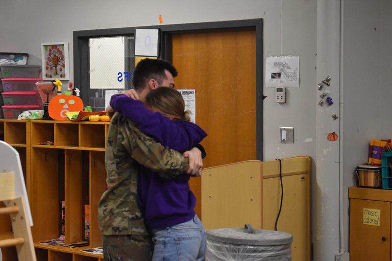 Brother and sister hugging