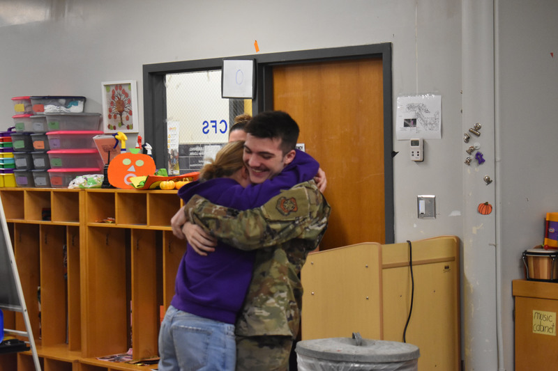 Brother and sister hugging