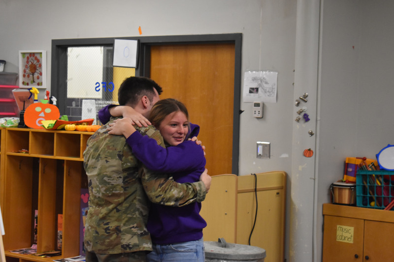 Brother and sister hugging