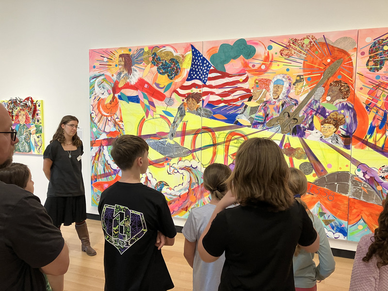 Students looking at painting in Wellin museum