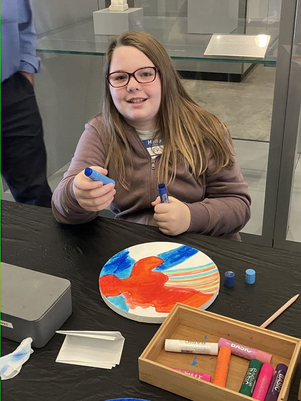 Students doing artwork at art museum