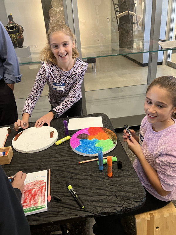 Students doing artwork at art museum