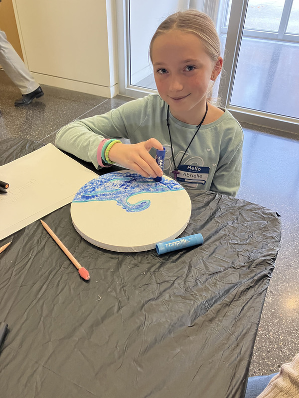 Students doing artwork at art museum