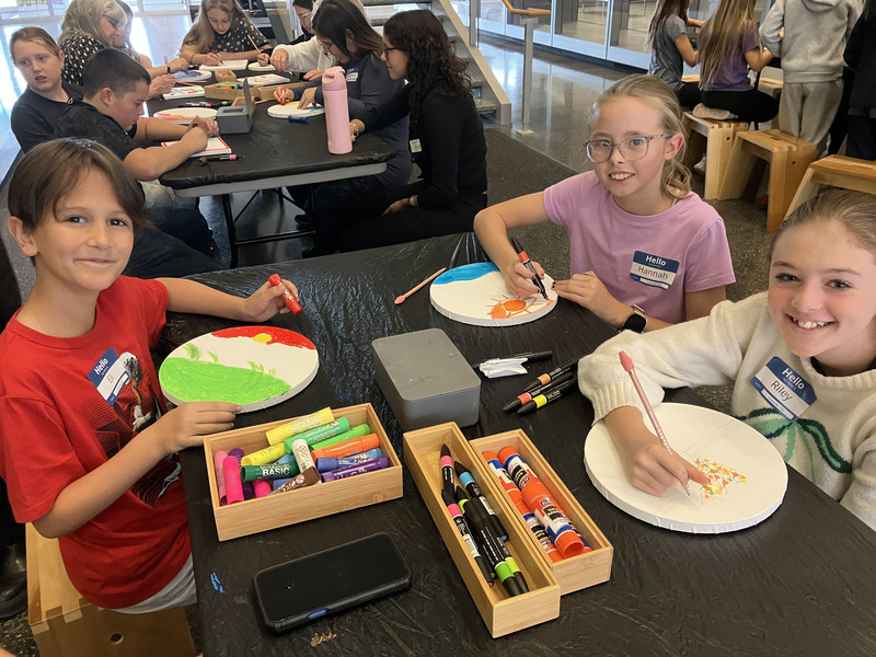 Students doing artwork at art museum