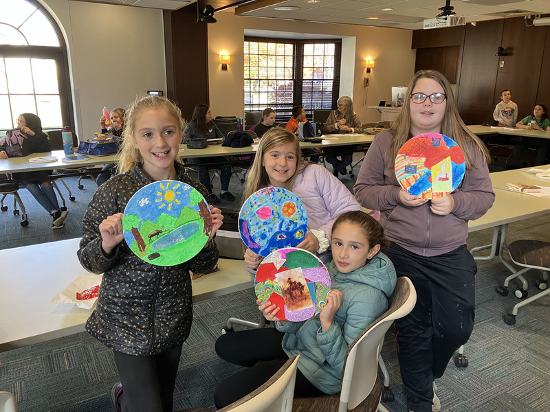 Students doing artwork at art museum