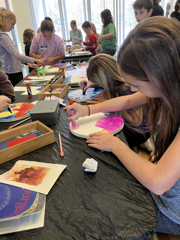 Students doing artwork at art museum