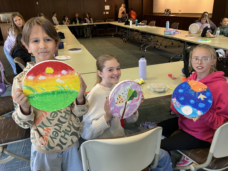 Students doing artwork at art museum