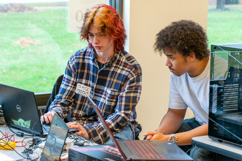 Two students working on computer