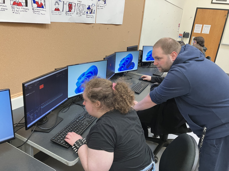 Teacher and student in computer lab
