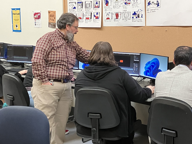 Student and assistant professor in computer lab