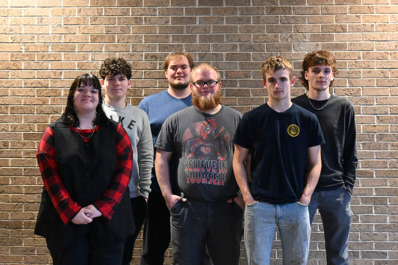 Six students standing together