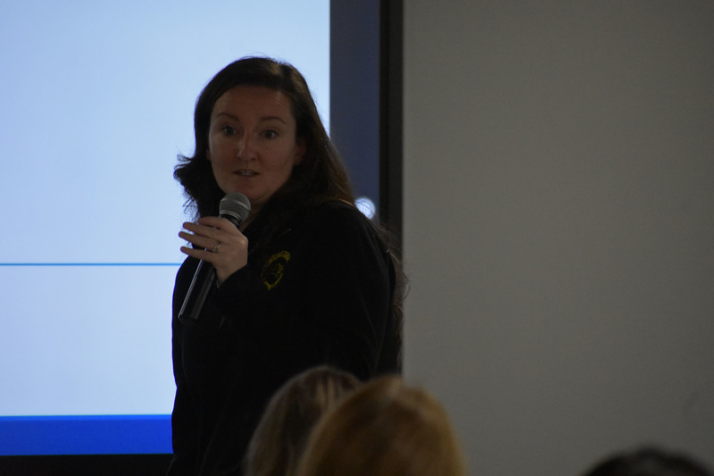 Safety presenter speaking on microphone