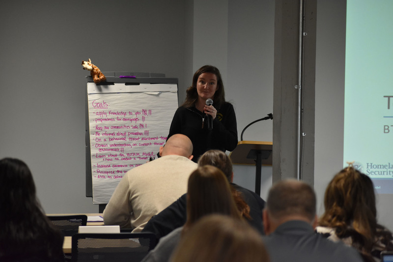 Safety presenter speaking on microphone