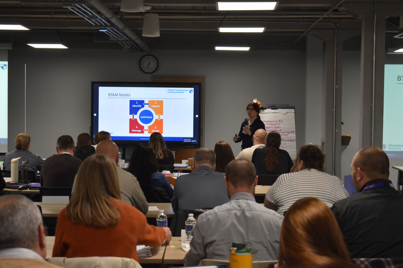 Local school, law enforcement and community representatives listen to safety presenter