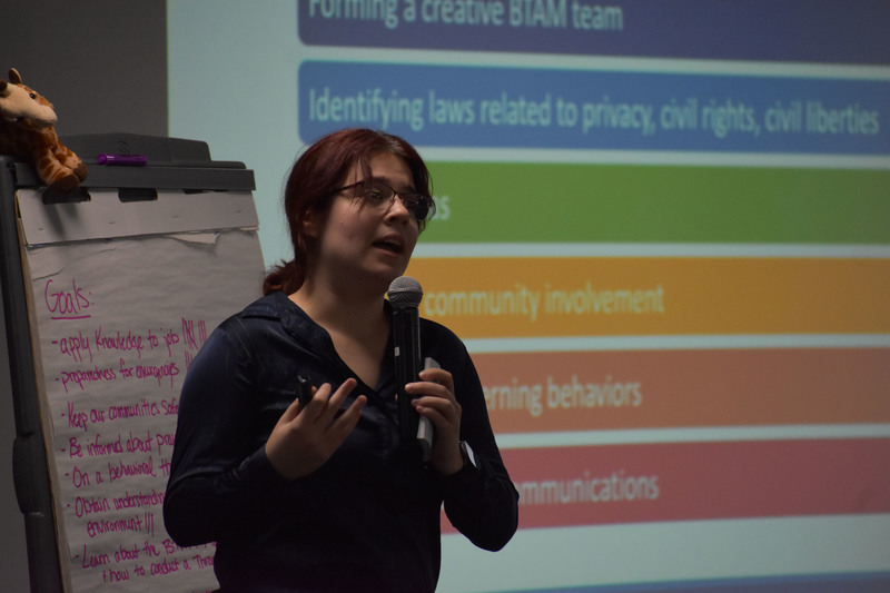 Safety presenter speaking into microphone