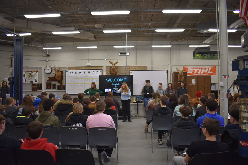 Large group of students listening to STC presenters