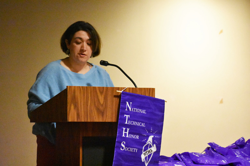 Keynote speaker talks at podium on stage