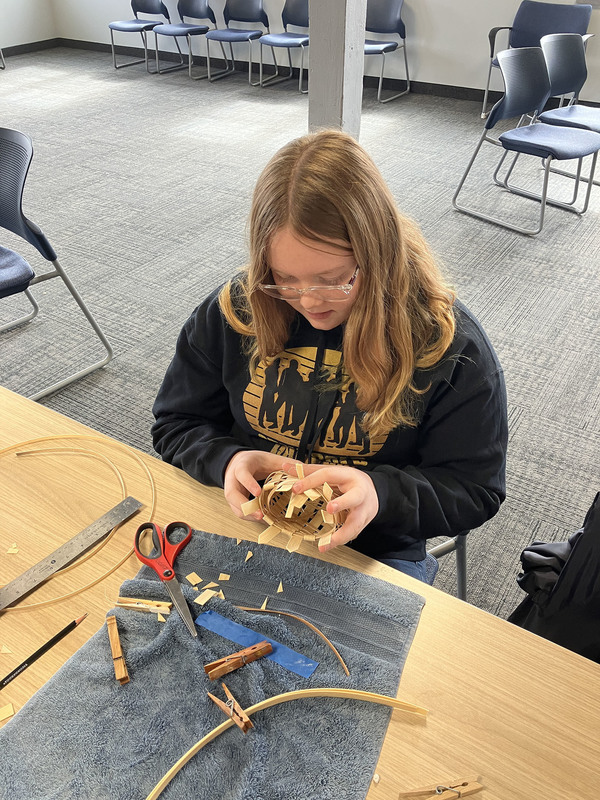 Student working on basket