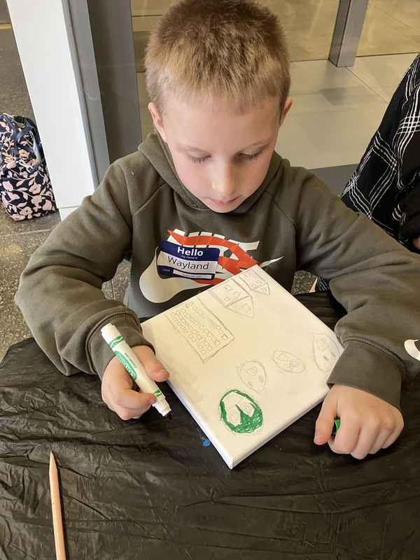 Student working on art project at art musem