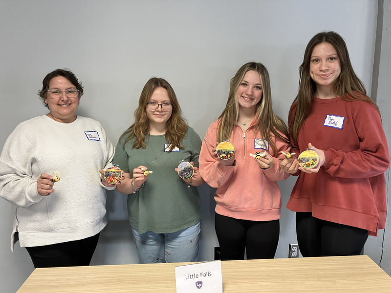 Students posing with needle felting work