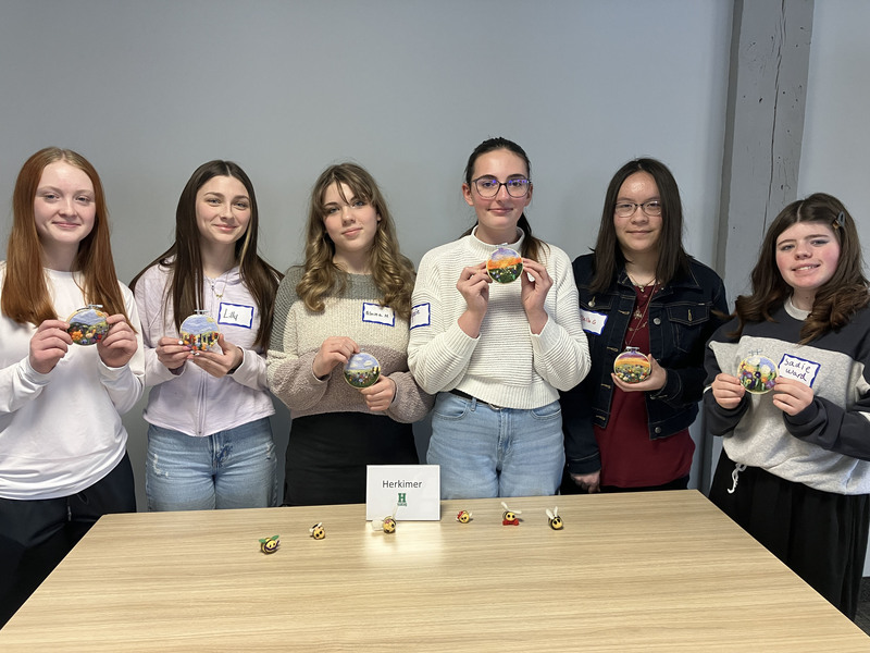 Students posing with needle felting work