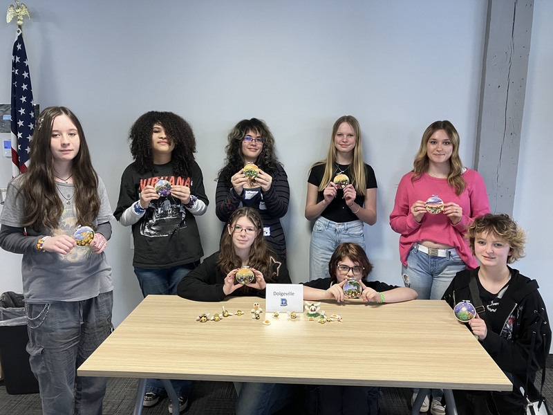 Students posing with needle felting work
